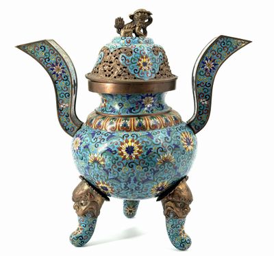 an image of a blue and gold teapot on a stand
