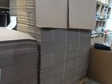 a large stack of cardboard sitting on a pallet in a warehouse