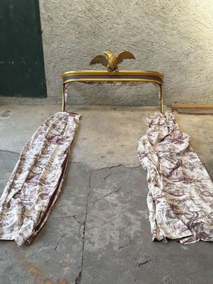 two pieces of cloth on the ground next to a chair