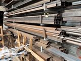 a lot of steel bars stacked on top of each other
