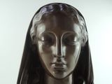 a statue of a woman with a veil on her head
