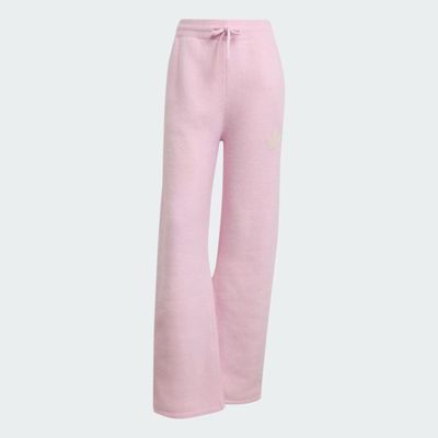 a woman ' s pink sweat pants with a white logo on the side