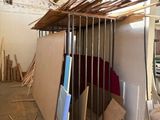 a picture of a room that has a lot of wood on the floor