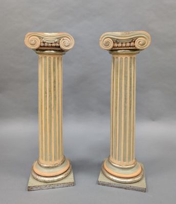 pair of antique marble columns with gold and white paint