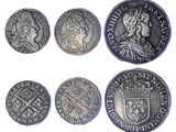 six different types of silver coins on a white background