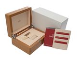 a wooden box with a pair of scissors inside of it