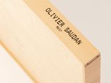 a close up of a wooden box with a logo on it