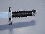 a close up of a knife with a blade on it