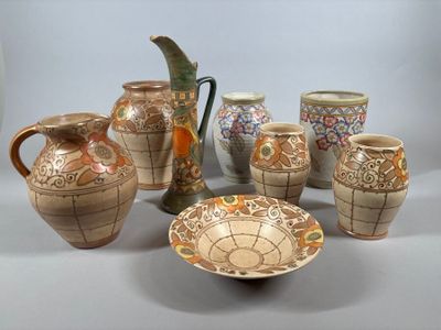 many different types of vases and bowls on the table