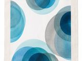 a close up of a napkin with blue circles on it