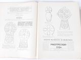 an open book with drawings on it on a white surface