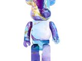 a purple and blue bear with a white shirt on