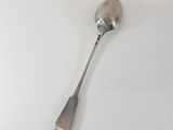a spoon that is sitting on a white table