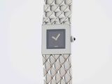 an image of a silver watch with a blue face on a white background