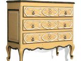 a small chest of drawers with ornate designs on it