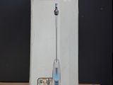 a blue and white electric toothbrush in a box