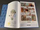 an open book with a picture of a man smoking a pipe