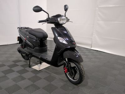 the motor scooter is parked in the garage on the floor