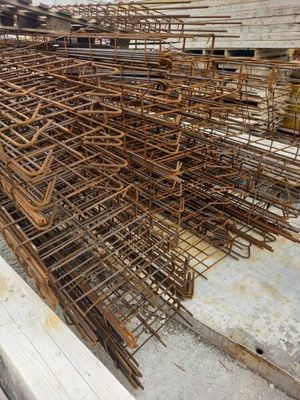 a large pile of steel bars stacked on top of each other