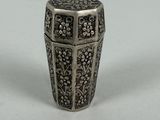an antique silver vase with a floral design on it