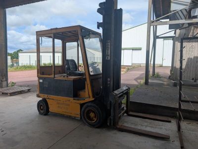a forklift that is parked in a warehouse