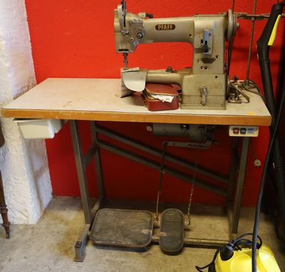 a sewing machine sitting on a table in a room