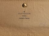 a close up of a louis vuitton bag on a white surface