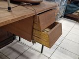 a wooden table with a pair of shoes on top of it