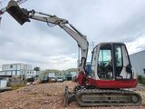 an image of a small excavator on a construction site