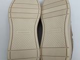 the soles of a pair of shoes on a white surface
