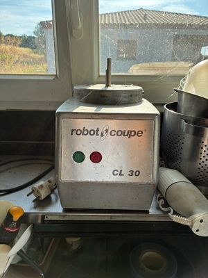 a robot that is sitting on a counter next to a window