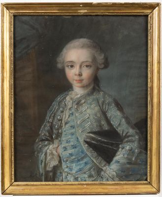 portrait of a young boy in a blue dress with a black book