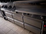 an image of a commercial kitchen with stainless steel appliances