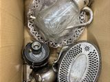 a box with a lot of silver items inside of it