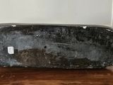 a black suitcase sitting on a wooden floor in a room