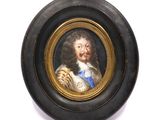 an old picture of a man with a beard in a black oval frame