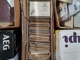 many boxes of mail sitting on the floor next to each other