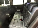 the back seats of a car with a seat belt in the back of it