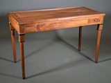 an old wooden table with a drawer on top of it