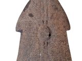 a stone object that is sitting on a white surface