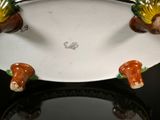 three birds sitting on top of a plate on a table