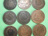 six different types of coins on a green surface