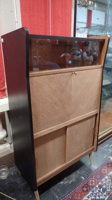 a display case with a glass door in the middle of it