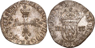 une pièce d'argent surmontée d'une couronne