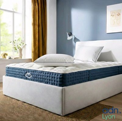 an image of a bedroom with a bed and a window