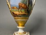 a vase with a picture of a cow on it