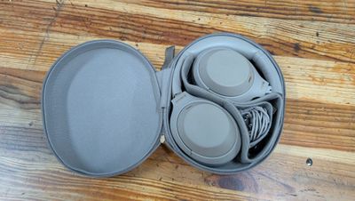 a container with a bunch of items in it on a wooden table