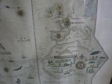 a map of the world on display in a glass case