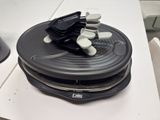 a stack of plates with ear buds on top of them