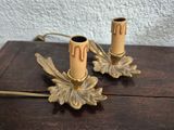 two candles that are sitting on a wooden table